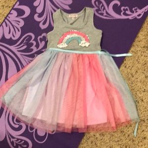 Cute casual rainbow dress with sequins! Satin ribbon at waist and tulle skirt